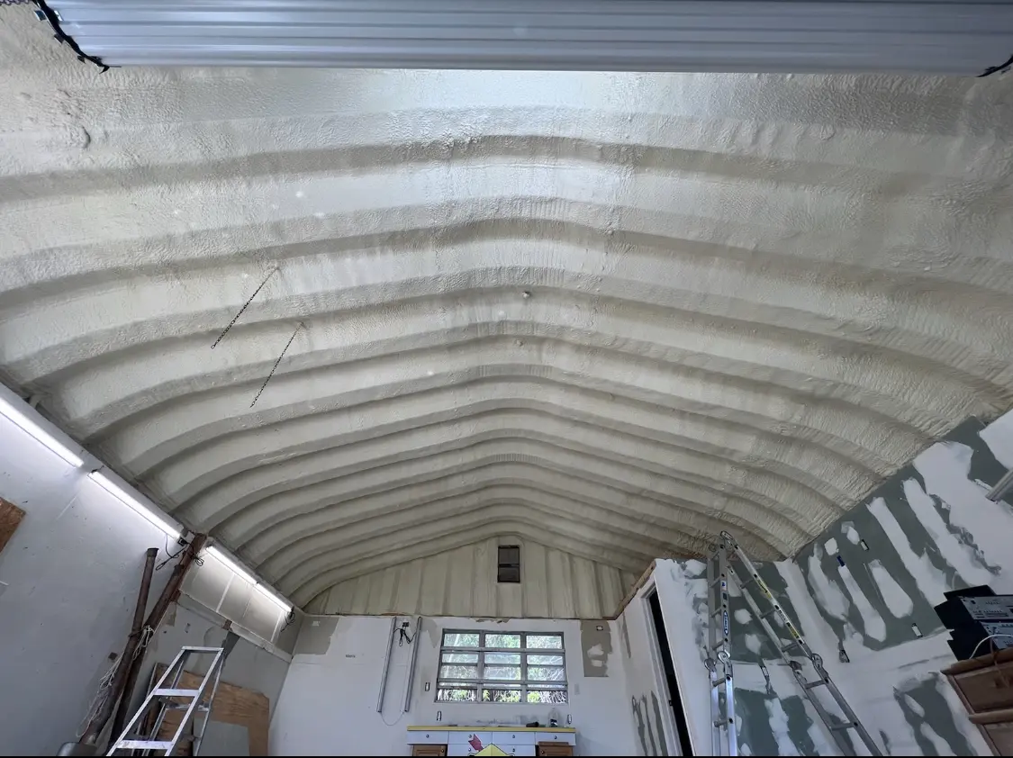 Spray polyurethane foam applied to the underside of a metal roof deck in Ambridge